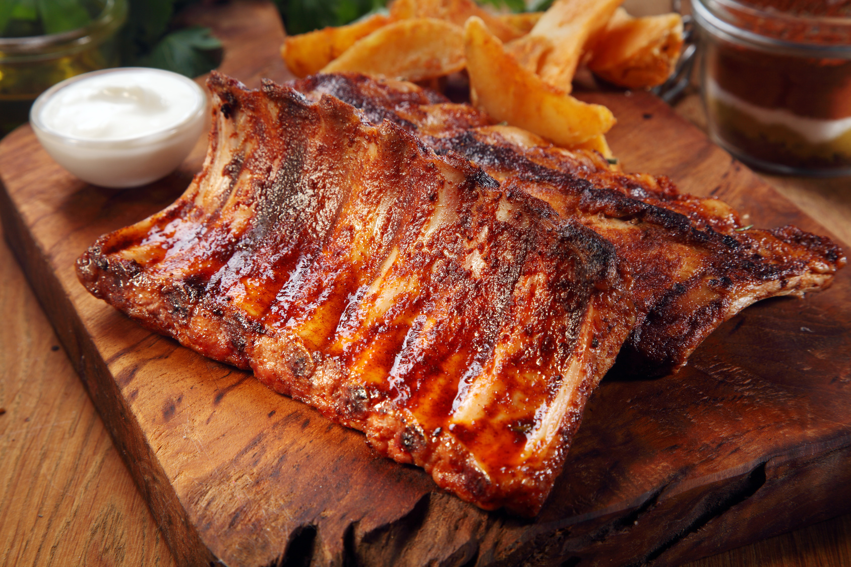 Close up Mouth Watering Juicy Grilled Pork Rib Meat on Top of Wooden Cutting Board
